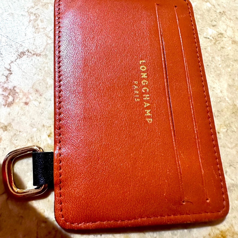 LONGCHAMP leather card case / orange / black with gold writing.